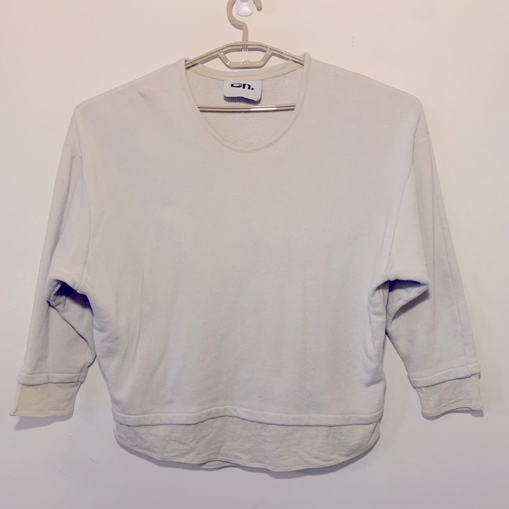 CHAPTER A/W 16 draped sweater with broad shoulders and cropped bottom.